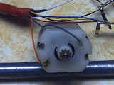 Orange and gray wires soldered to motor