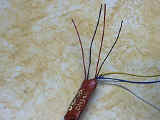 Orange and gray wires cut to length