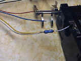 Resistor soldered to 1 inch white wire